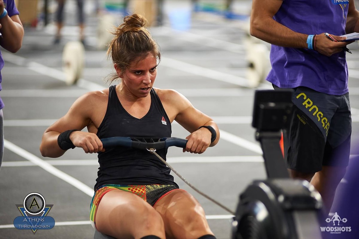 female ahlete competing on a row machine
